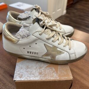 Golden Goose white and gold Superstar Sneakers